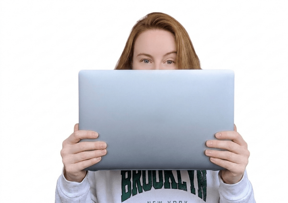 Photo of Hannah ONeill a copywriter in Northampton holding a laptop.